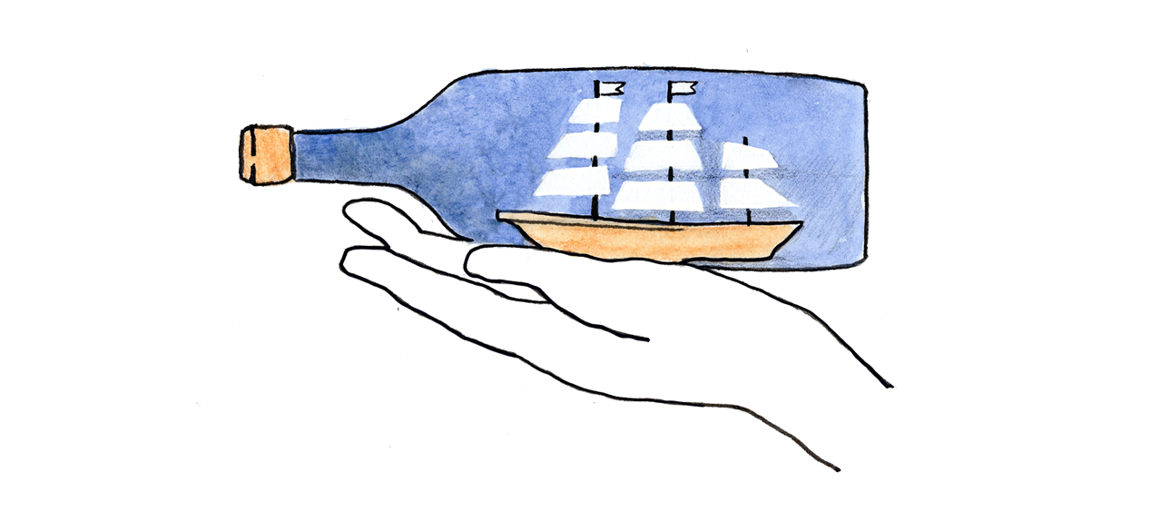 A hand holding a bottle containing a ship - the message in a bottle